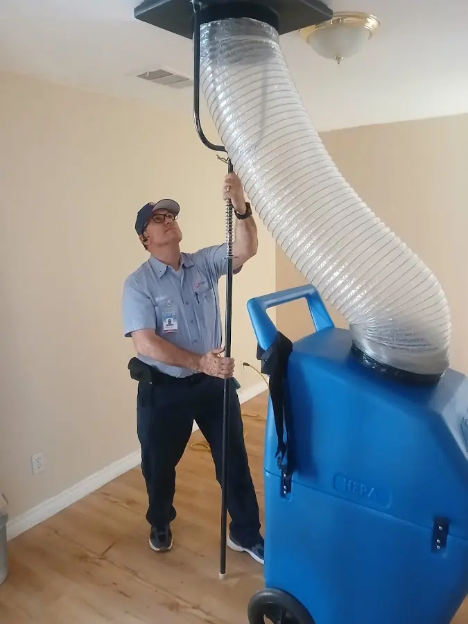 Furnace Tune-Up technician using HEPA equipment in Dayton